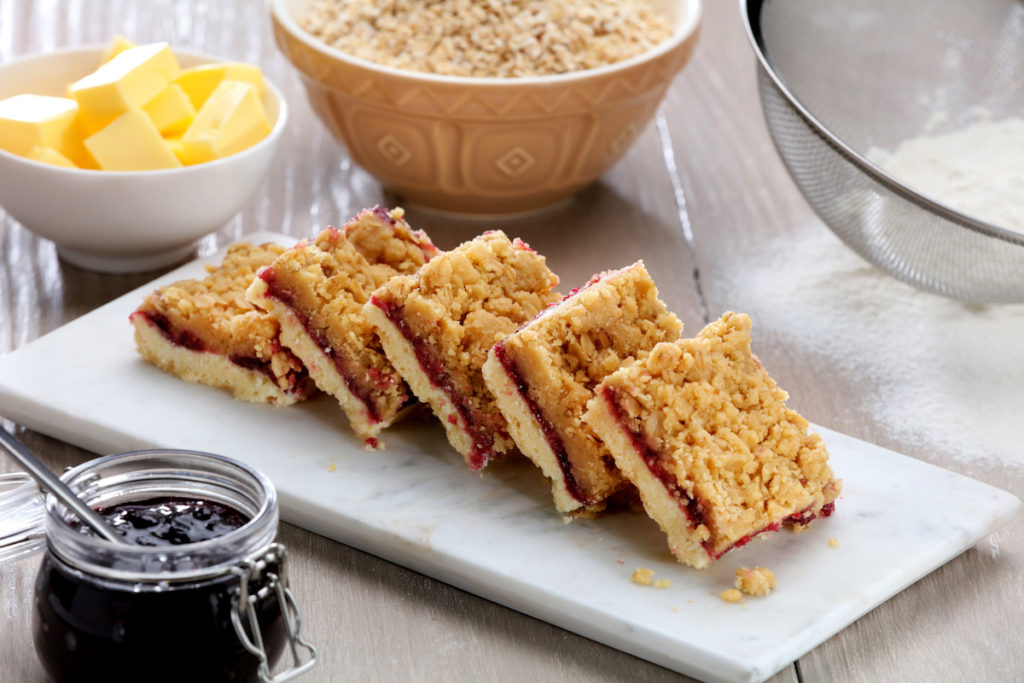 C17997 GF Blackcurrant Crumble Slice. Available from MKG Foods, your foodservice partner in the Midlands.