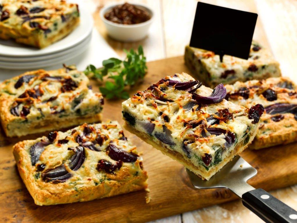 C23247 Red Onion Goats Cheese Spinach & Cranberry Traybake. Available from MKG Foods, your foodservice partner in the Midlands.