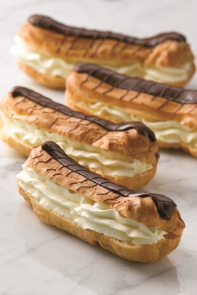 C13114 - Large Chocolate topped Fresh Cream Éclair. Available from MKG Foods, your foodservice partner in the Midlands.