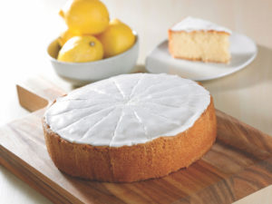 C18004 - Iced Lemon Drizzle Cake pre-cut. Available from MKG Foods, your foodservice partner in the Midlands.