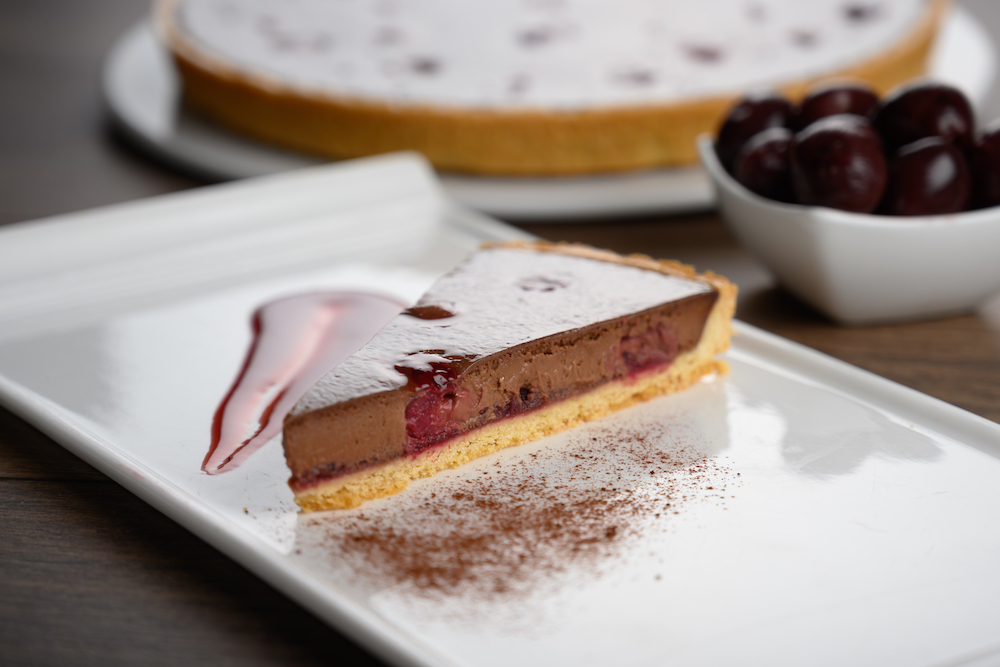 C23078 - Baked Belgian Chocolate & Black Cherry Tart. Available from MKG Foods, your foodservice partner in the Midlands.