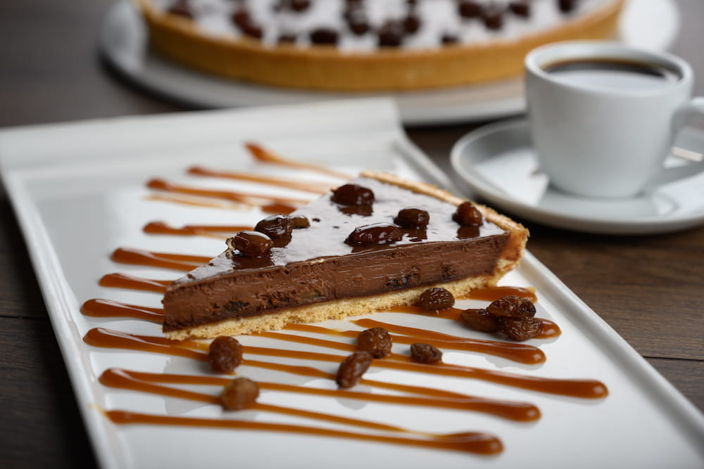 C23079 - Dark Chocolate Rum & Raisin Tart. Available from MKG Foods, your foodservice partner in the Midlands.