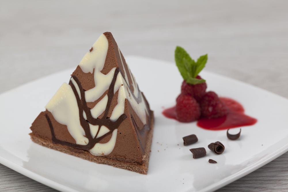 C23083 - Marbled Chocolate & Raspberry Pyramid. Available from MKG Foods, your foodservice partner in the Midlands.
