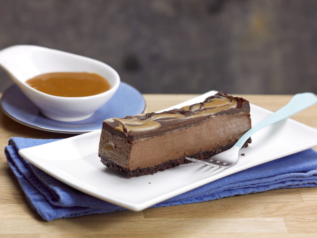 C17033 - Vegan Chocolate Salted Caramel Cheesecake. Available from MKG Foods, your foodservice partner in the Midlands.