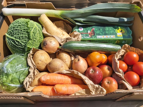 Large fresh produce box with fruit, vegetables and eggs. Available for home delivery with MKG Foods.