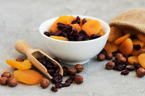Dried fruits and nuts on a old wooden table Dried fruits and nuts on a old wooden table